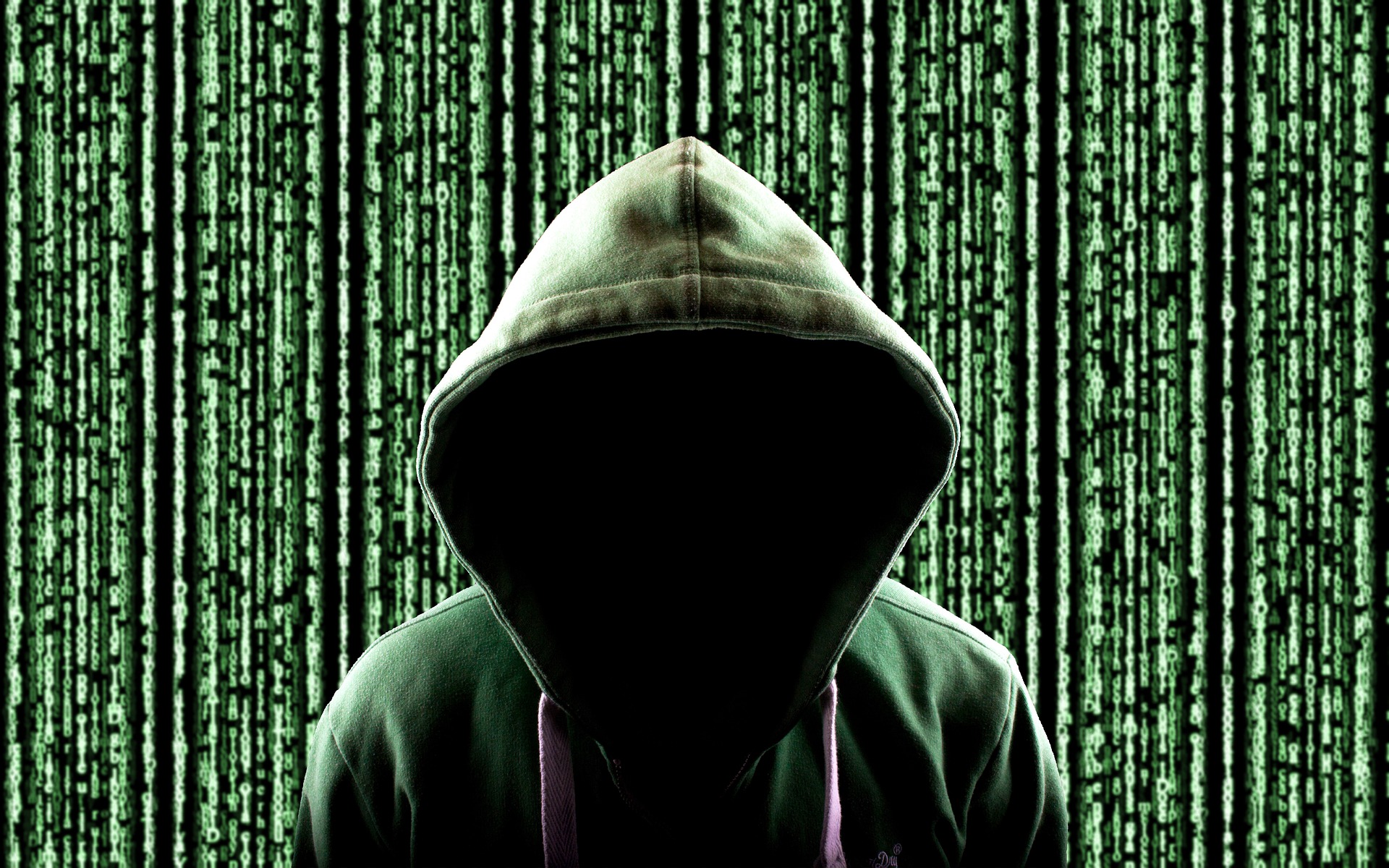 no-face showing hacker with green digital background